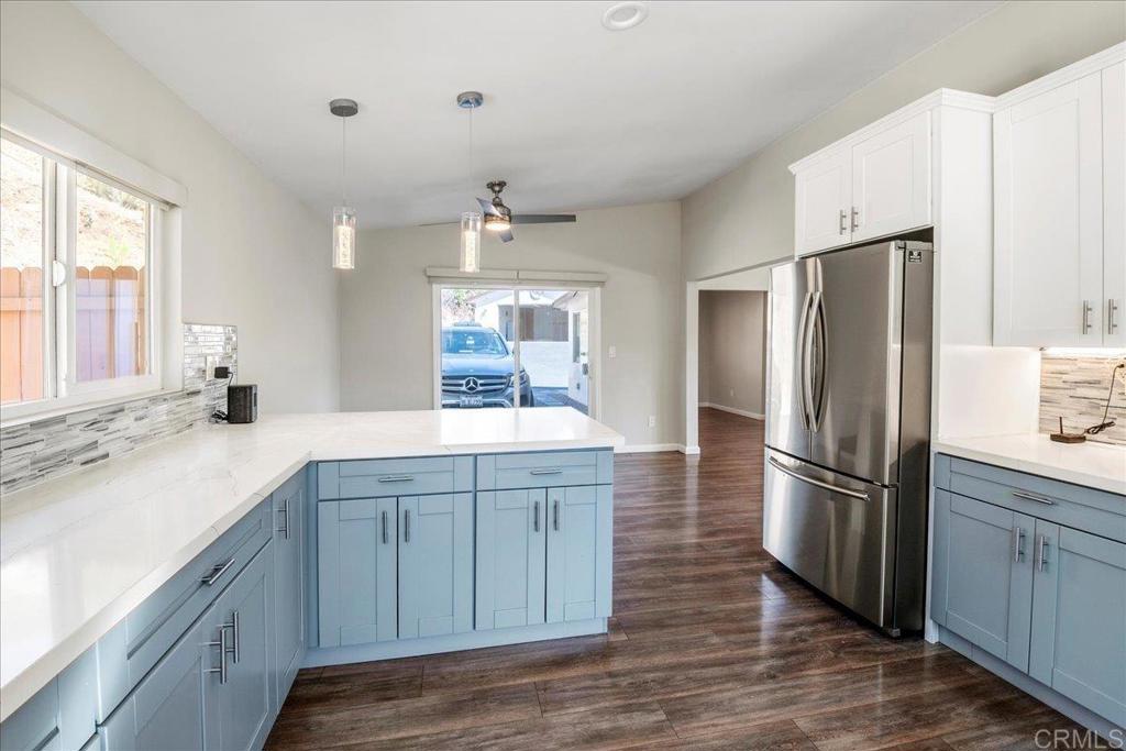 11694 Hi Ridge Road Lakeside, CA 92040 - Photo 11 of 48 a kitchen with a refrigerator sink and cabinets