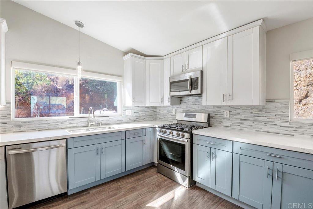 11694 Hi Ridge Road Lakeside, CA 92040 - Photo 12 of 48 a kitchen with sink cabinets and window