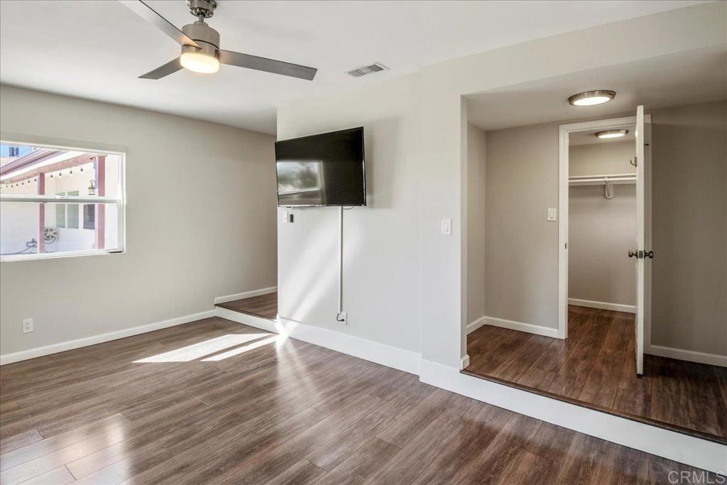 11694 Hi Ridge Road Lakeside, CA 92040 - Photo 17 of 48 a view of empty room with wooden floor and fan
