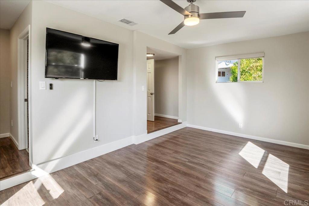 11694 Hi Ridge Road Lakeside, CA 92040 - Photo 18 of 48 a view of a livingroom with wooden floor and flat screen tv
