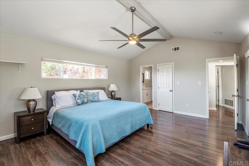 11694 Hi Ridge Road Lakeside, CA 92040 - Photo 26 of 48 a bedroom with a bed and wooden floor