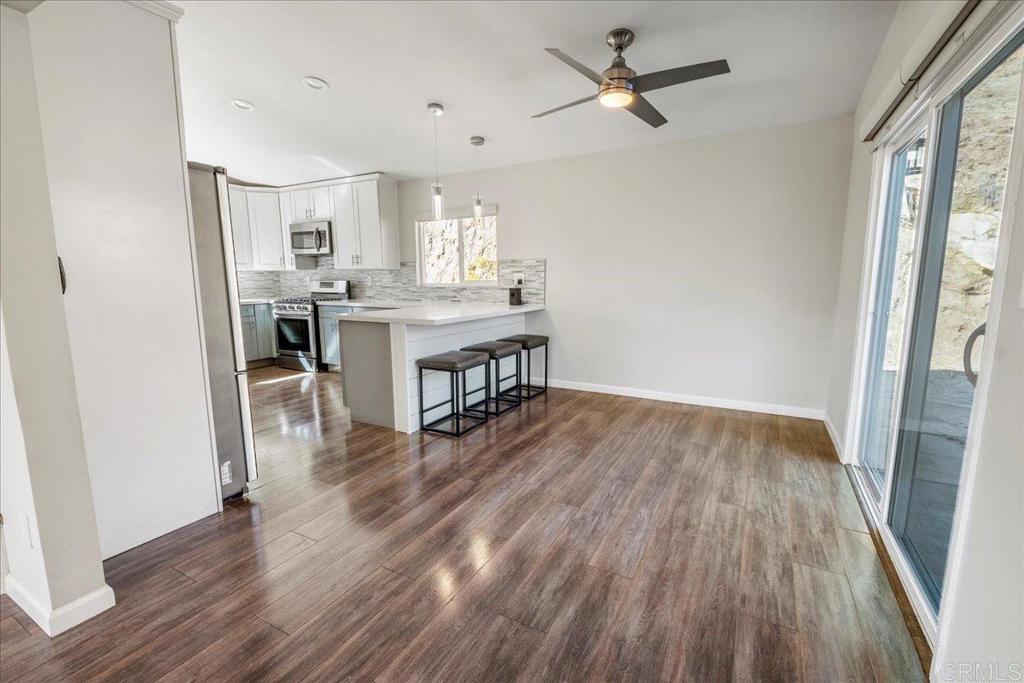 11694 Hi Ridge Road Lakeside, CA 92040 - Photo 7 of 48 a view of a workspace with wooden floor and a window