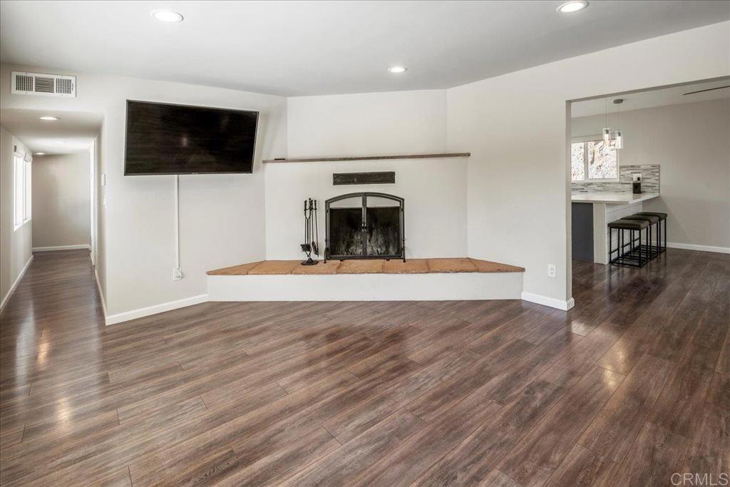 11694 Hi Ridge Road Lakeside, CA 92040 - Photo 8 of 48 a view of a livingroom with a flat screen tv and fireplace