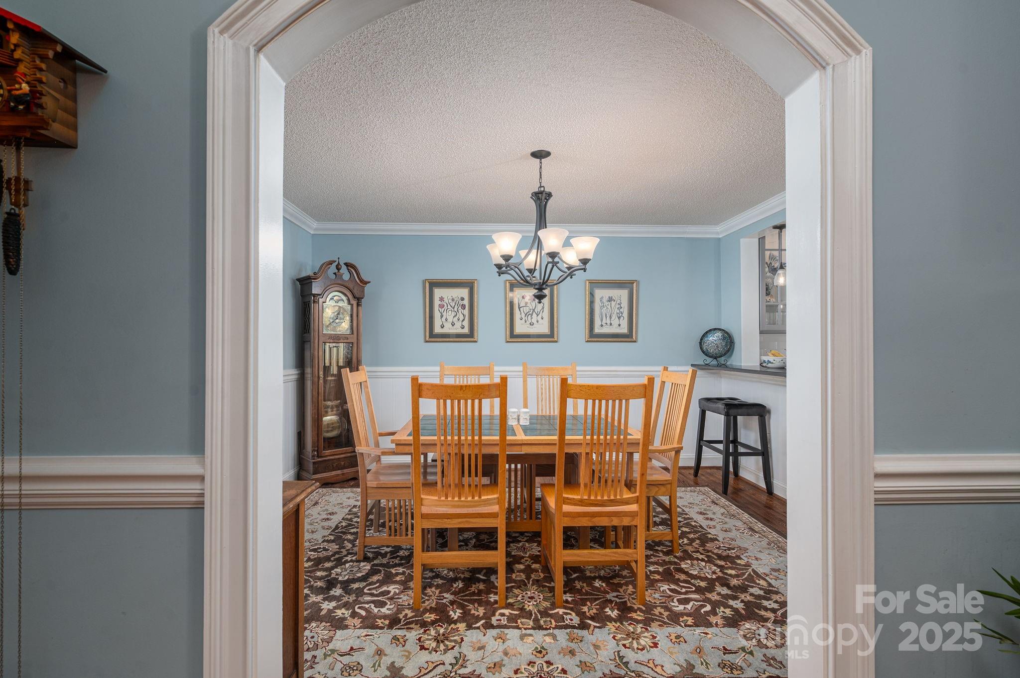 8369 Slate Street Terrell, NC 28682 - Photo 18 of 47 a view of a dining room with furniture and chandelier