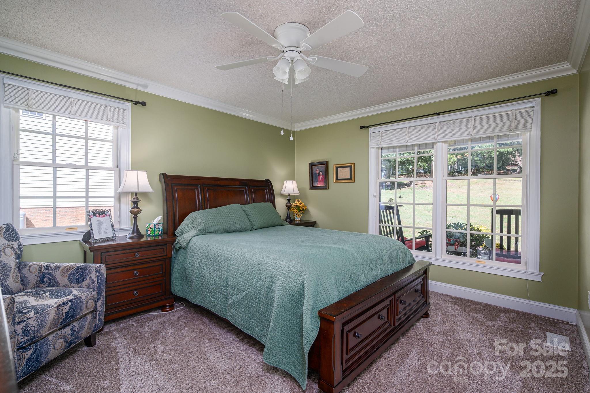 8369 Slate Street Terrell, NC 28682 - Photo 25 of 47 a bed sitting in a bedroom next to a window