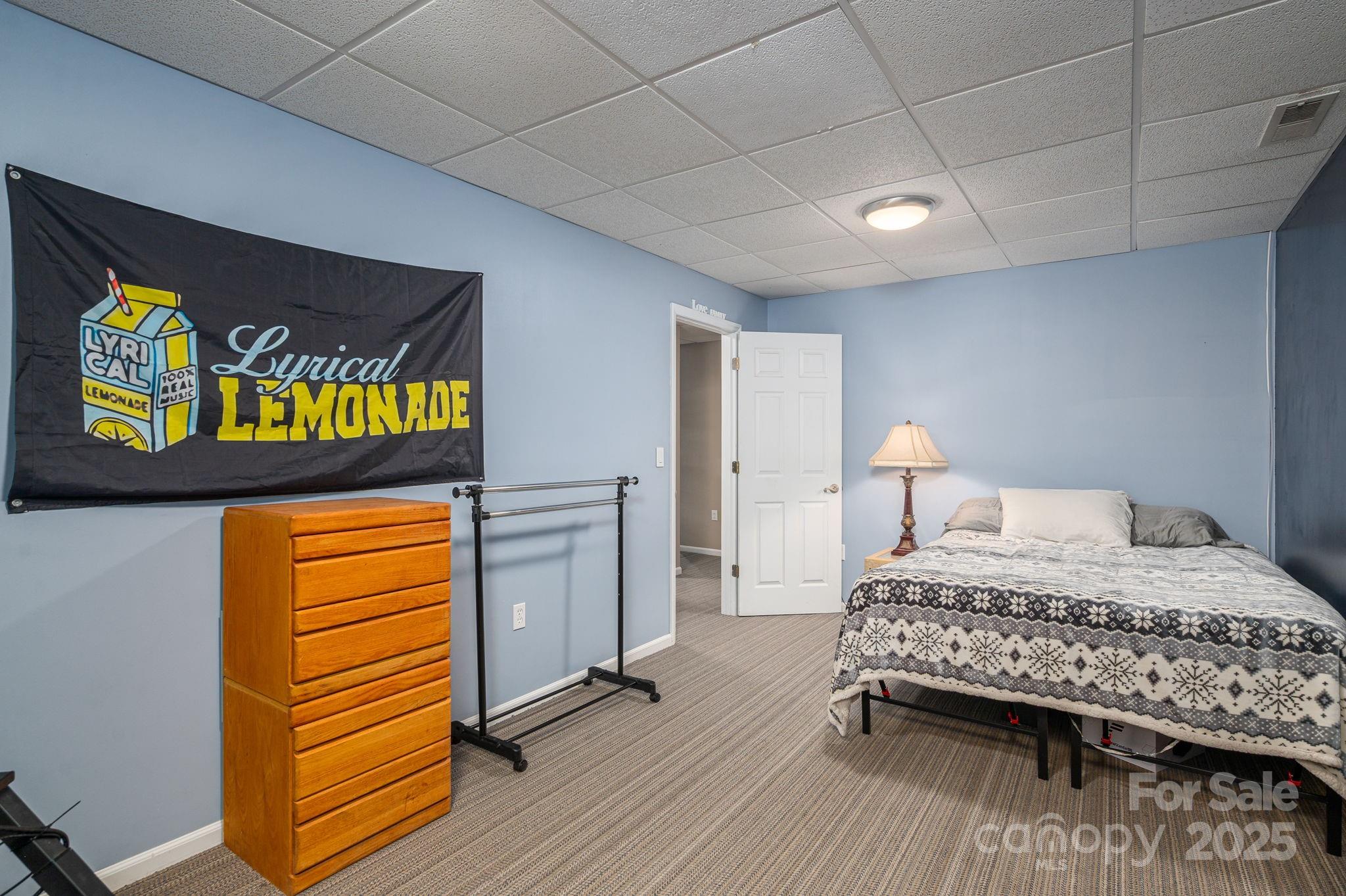 8369 Slate Street Terrell, NC 28682 - Photo 33 of 47 a bedroom with a bed and a dresser