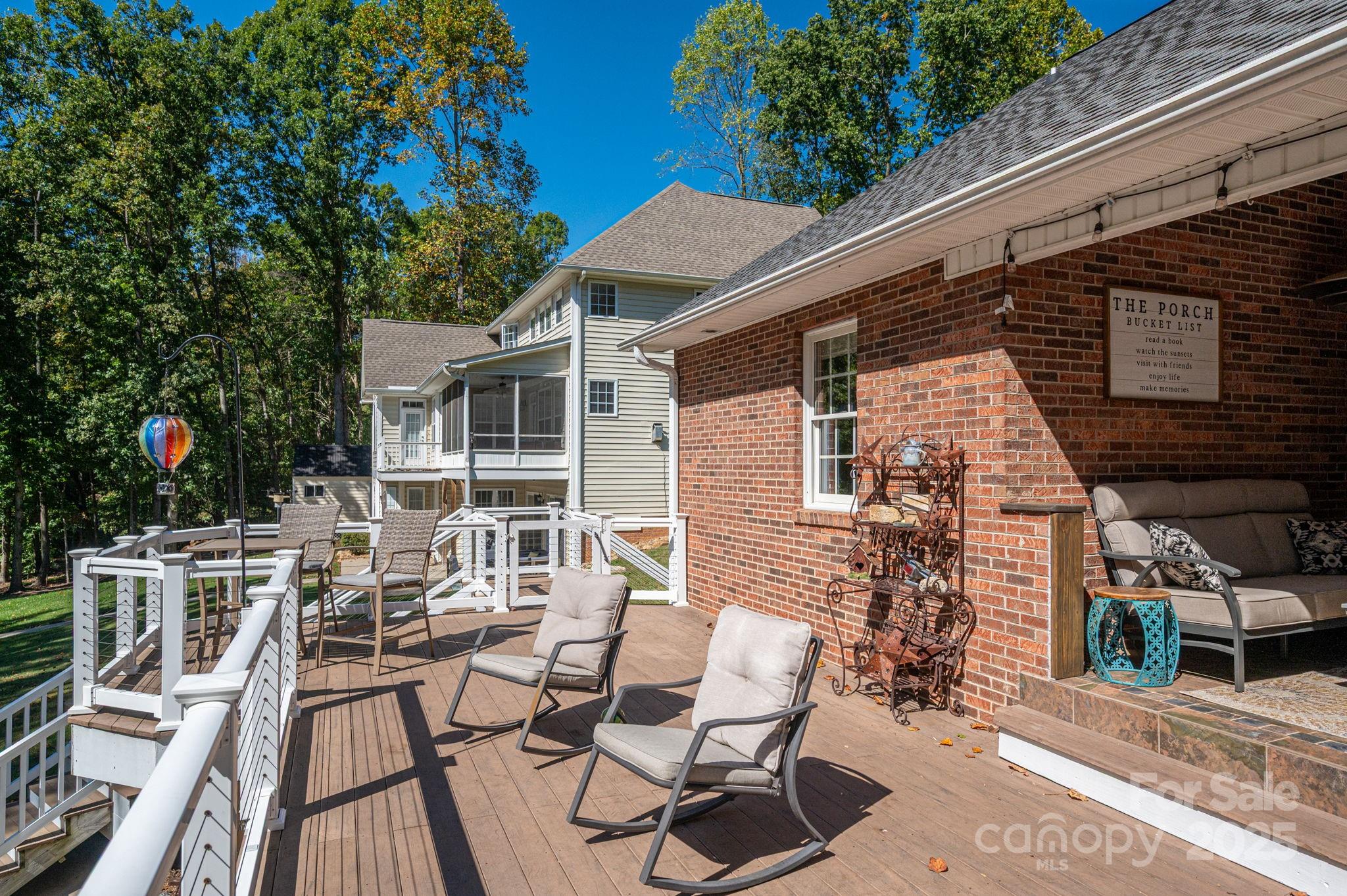 8369 Slate Street Terrell, NC 28682 - Photo 36 of 47 a view of a patio with table and chairs and potted plants