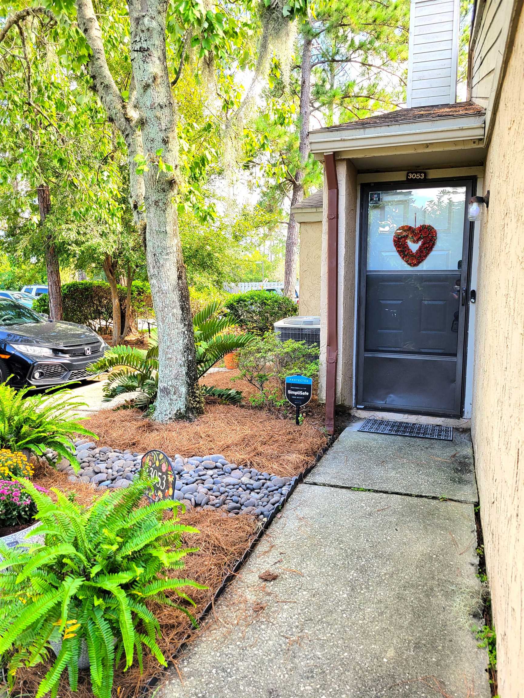 3801 Crown Point Road, Unit 3053 Jacksonville, FL 32257 - Photo 6 of 27 a couple of potted plants in front of door