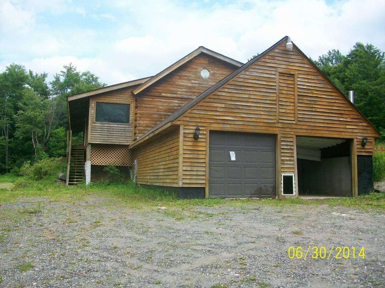 75 West Main Road Peru, MA 01235 - Photo 1 of 10 a front view of a house with garden