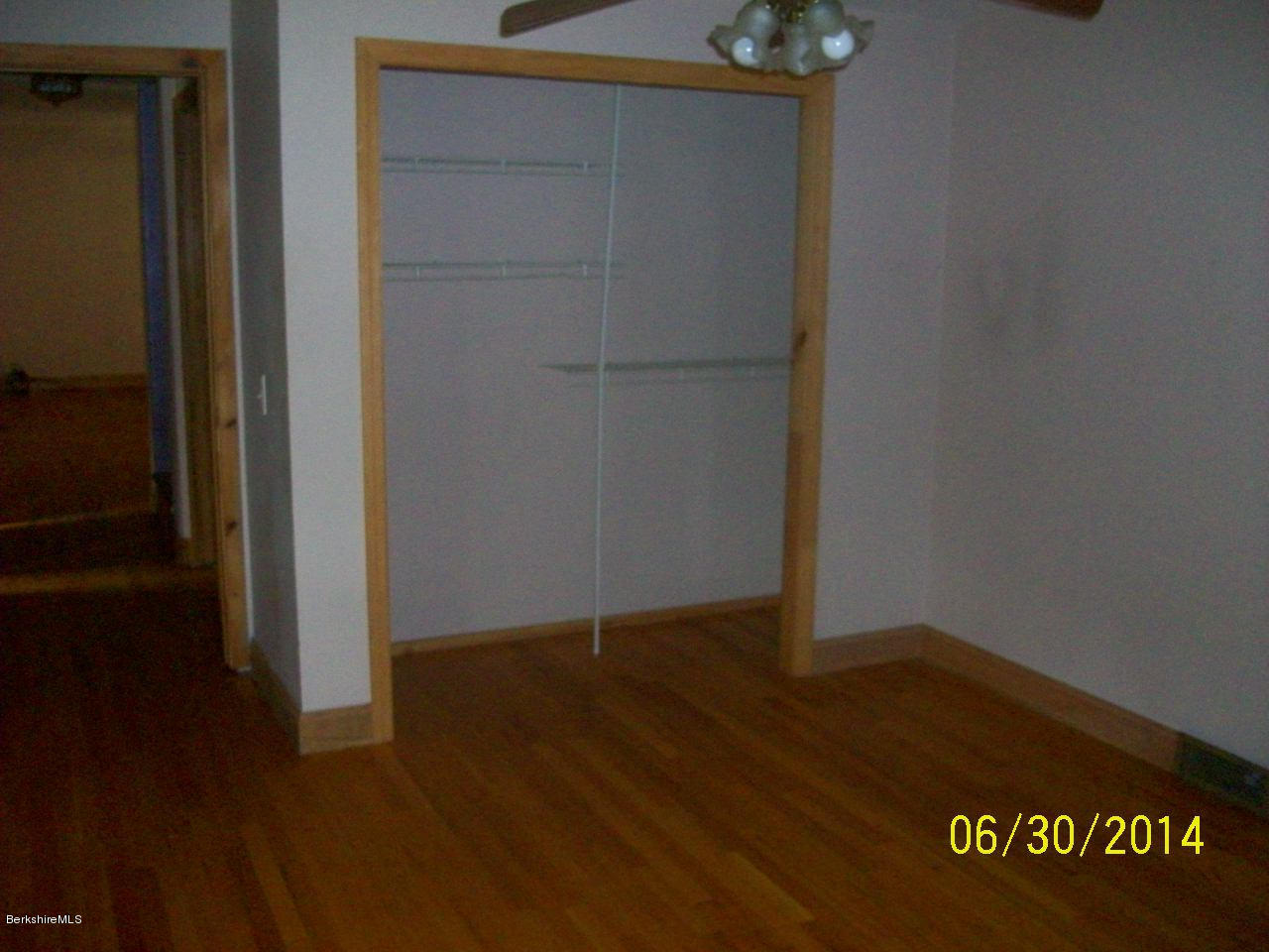 75 West Main Road Peru, MA 01235 - Photo 5 of 10 an empty room with wooden floor