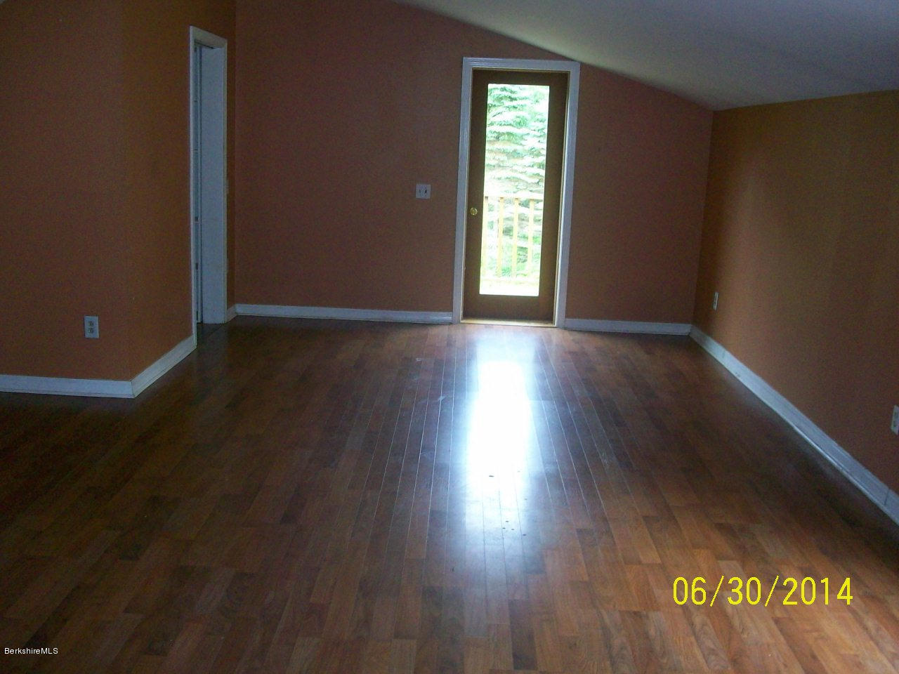 75 West Main Road Peru, MA 01235 - Photo 7 of 10 an empty room with wooden floor and windows
