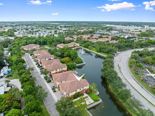 an aerial view of a city with lake view
