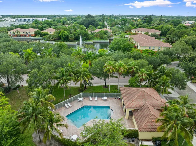 an aerial view of a house with yard swimming pool and outdoor seating