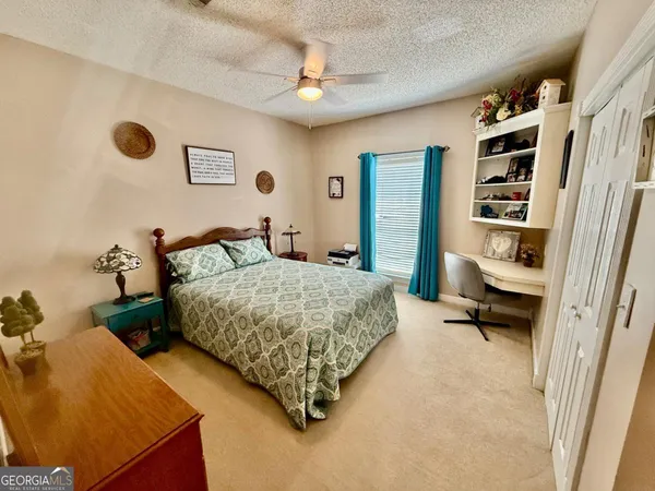 a bedroom with a bed and a cabinets