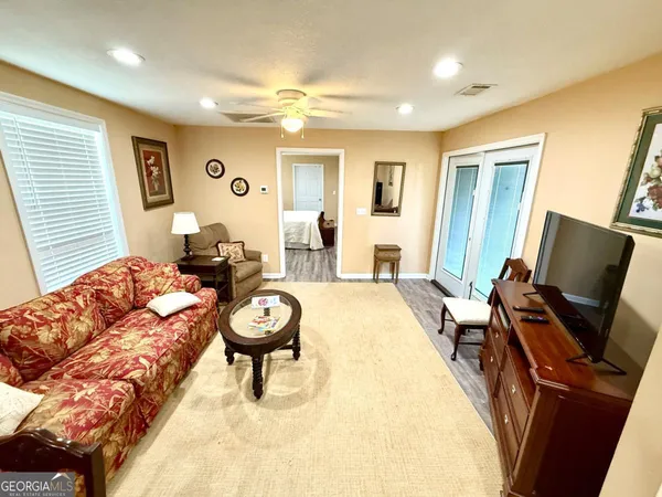a living room with furniture and a large window
