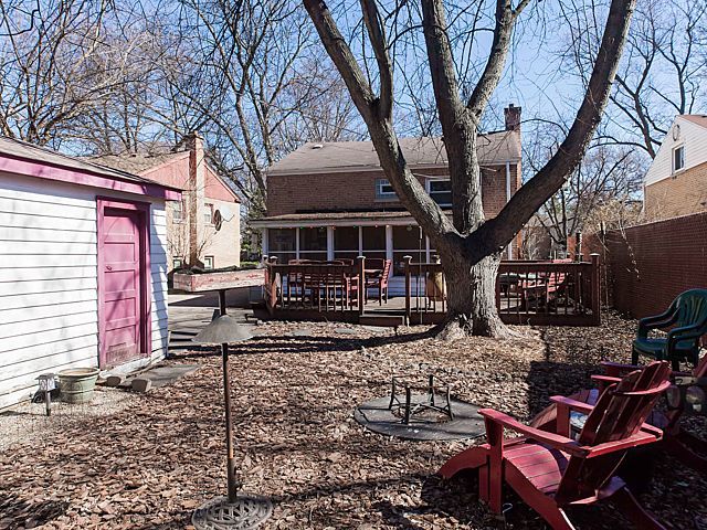 632 Long Road Glenview, IL 60025 - Photo 3 of 4 a view of a chairs and fire pit in the backyard of the house