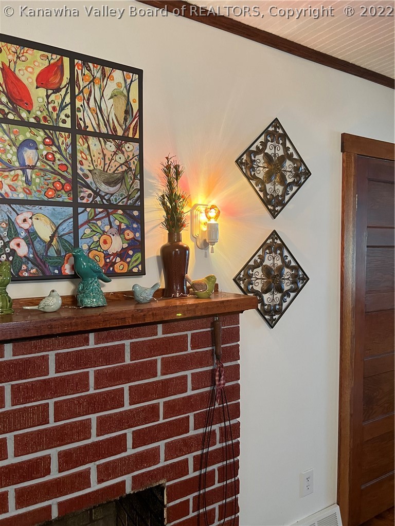 8297 Charleston Road Walton, WV 25286 - Photo 43 of 47 Electric lights adorn the fireplace