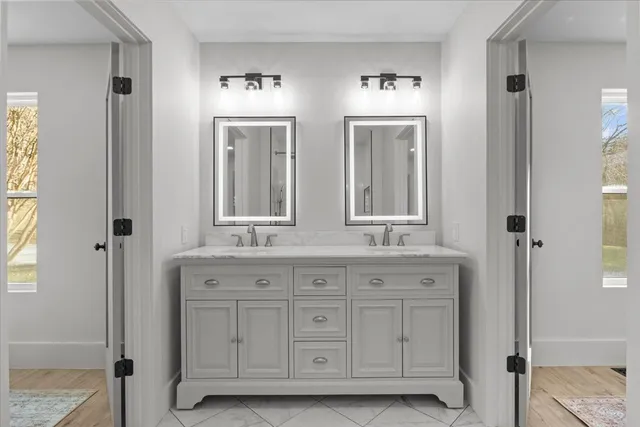 a bathroom with a bathtub and a shower