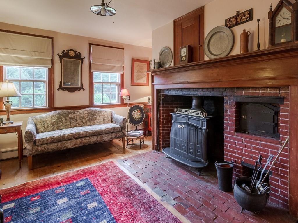295 Lowell Town Road Wiscasset, ME 04578 - Photo 12 of 25 Living room with antique hearth and...