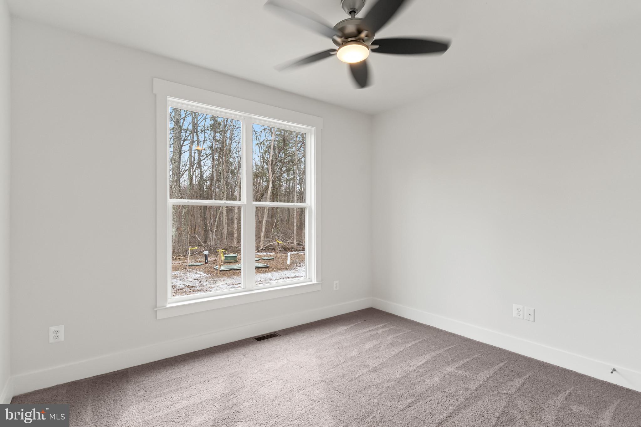6735 Beverly Road Broad Run, VA 20137 - Photo 16 of 30 Carpeted empty room with a ceiling fan and baseboa