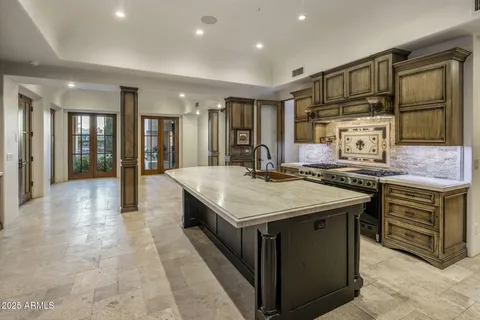 a bathroom with a sink and a large mirror