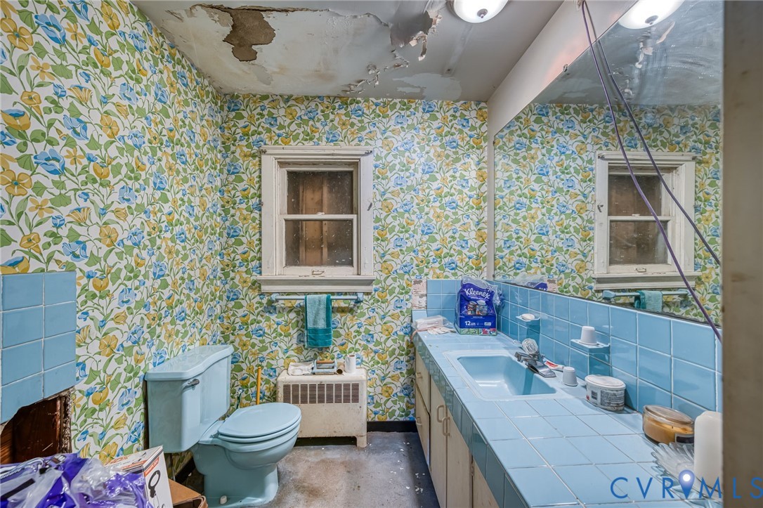 6243 Studley Road Mechanicsville, VA 23116 - Photo 16 of 75 a bathroom with a sink a toilet and shower curtain