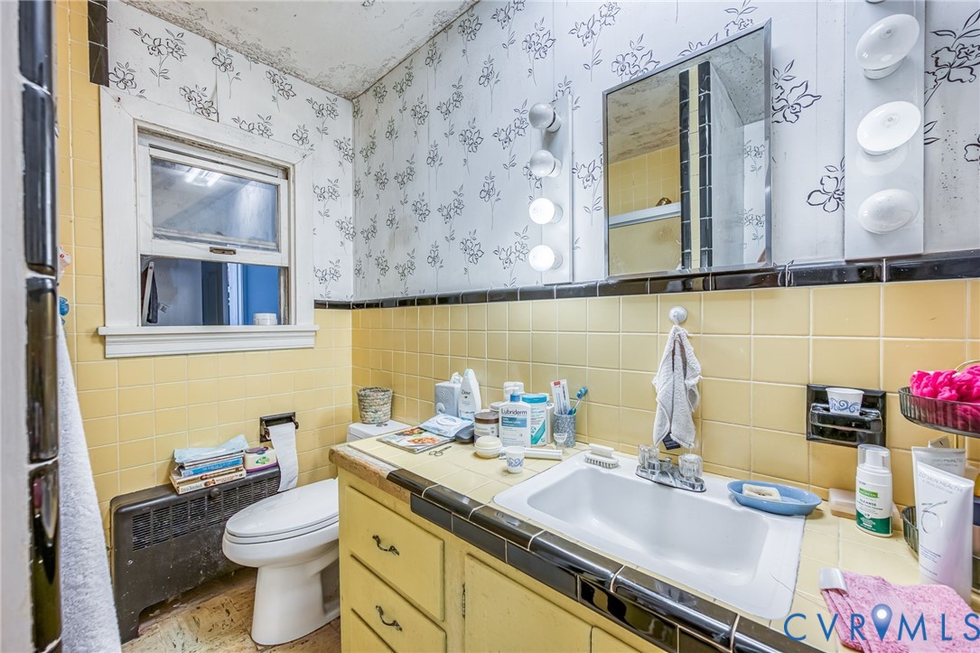 6243 Studley Road Mechanicsville, VA 23116 - Photo 19 of 75 a bathroom with a granite countertop sink and a mirror