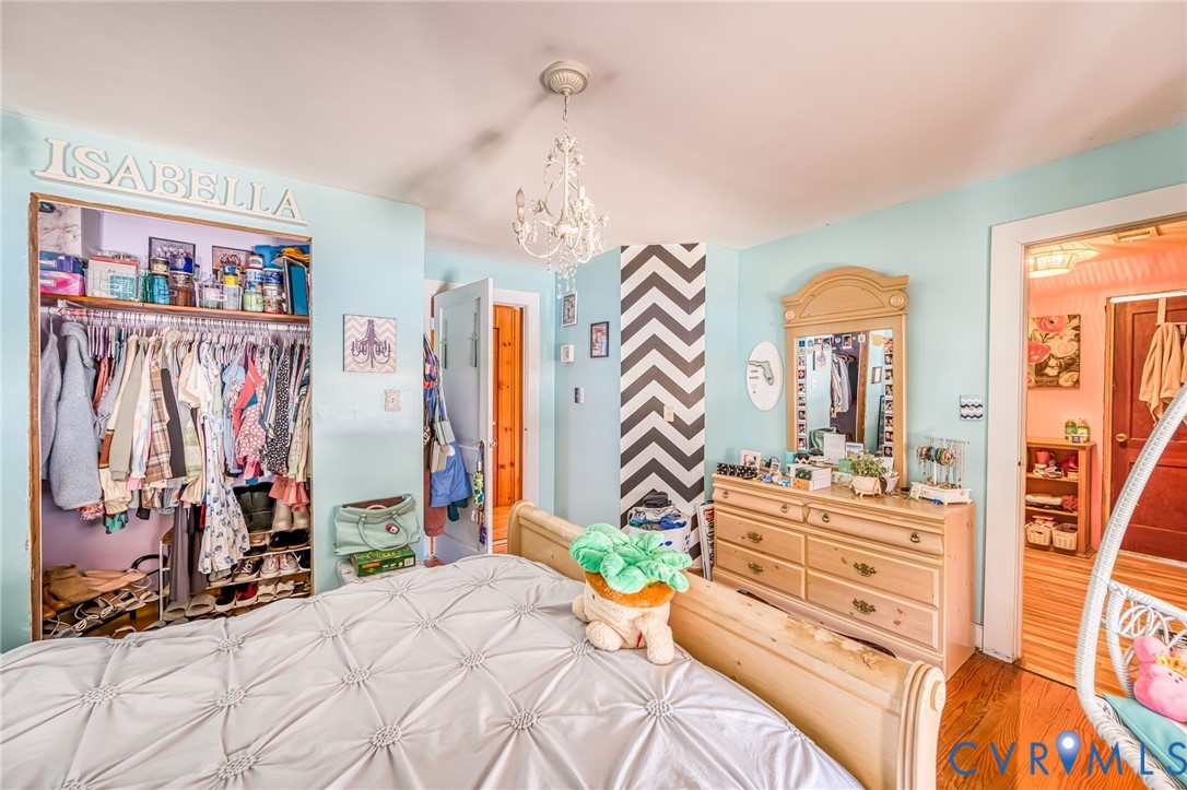 6243 Studley Road Mechanicsville, VA 23116 - Photo 33 of 75 a bedroom with furniture and a large mirror