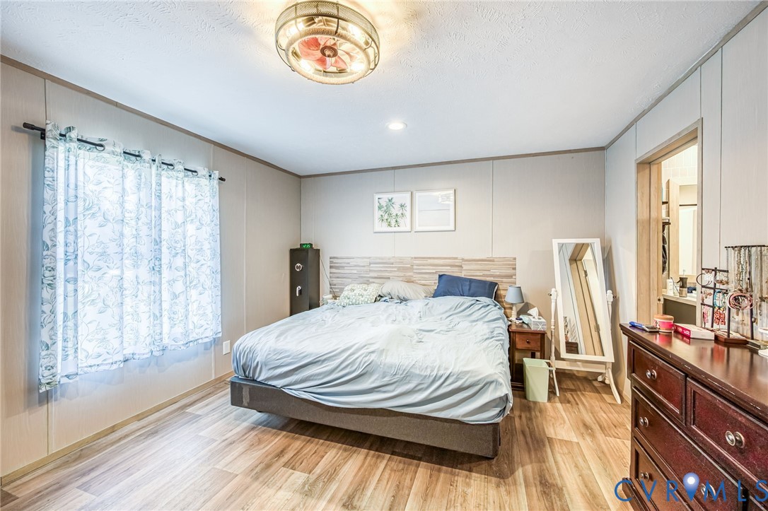 6243 Studley Road Mechanicsville, VA 23116 - Photo 54 of 75 a bedroom with a bed and a large window with the outer view