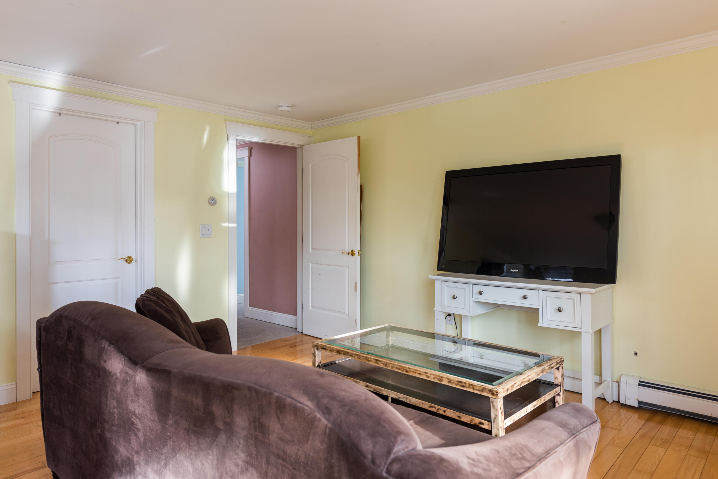 322 Pleasant Street Chatham, MA 02659 - Photo 11 of 39 a living room with furniture and a flat screen tv