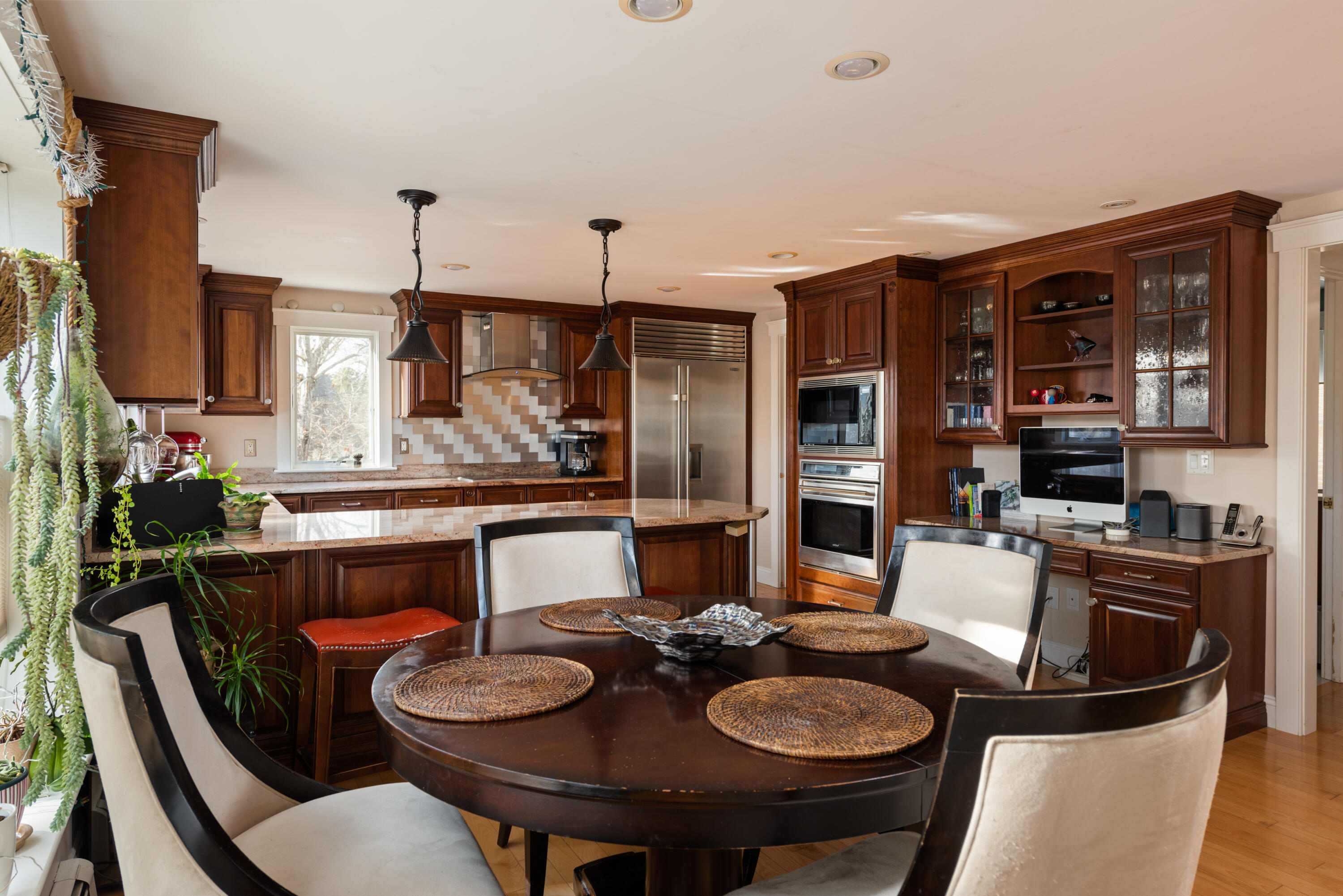 322 Pleasant Street Chatham, MA 02659 - Photo 18 of 39 a kitchen with a table and chairs in it
