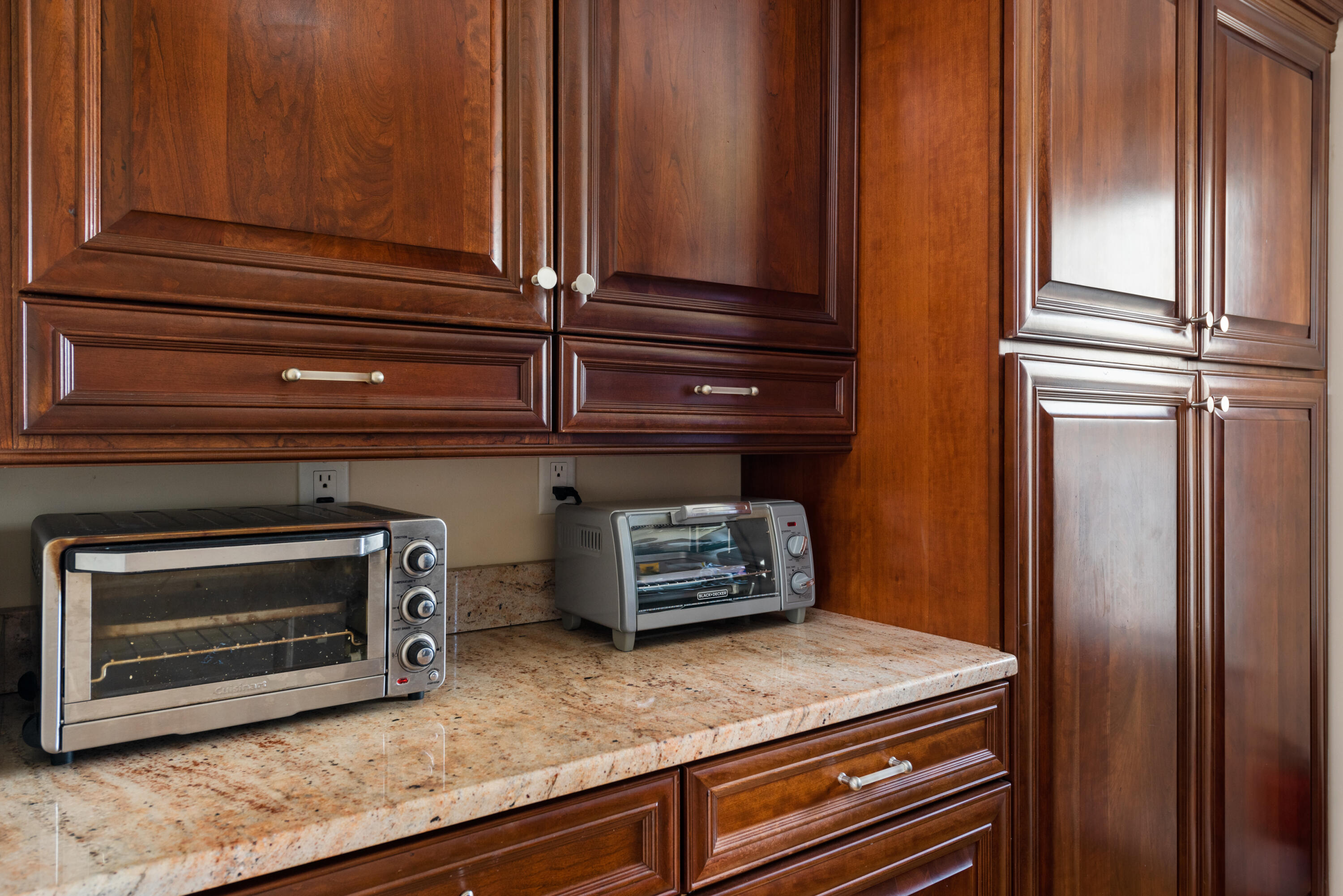 322 Pleasant Street Chatham, MA 02659 - Photo 19 of 39 a kitchen with granite countertop cabinets stainless steel appliances and a counter space
