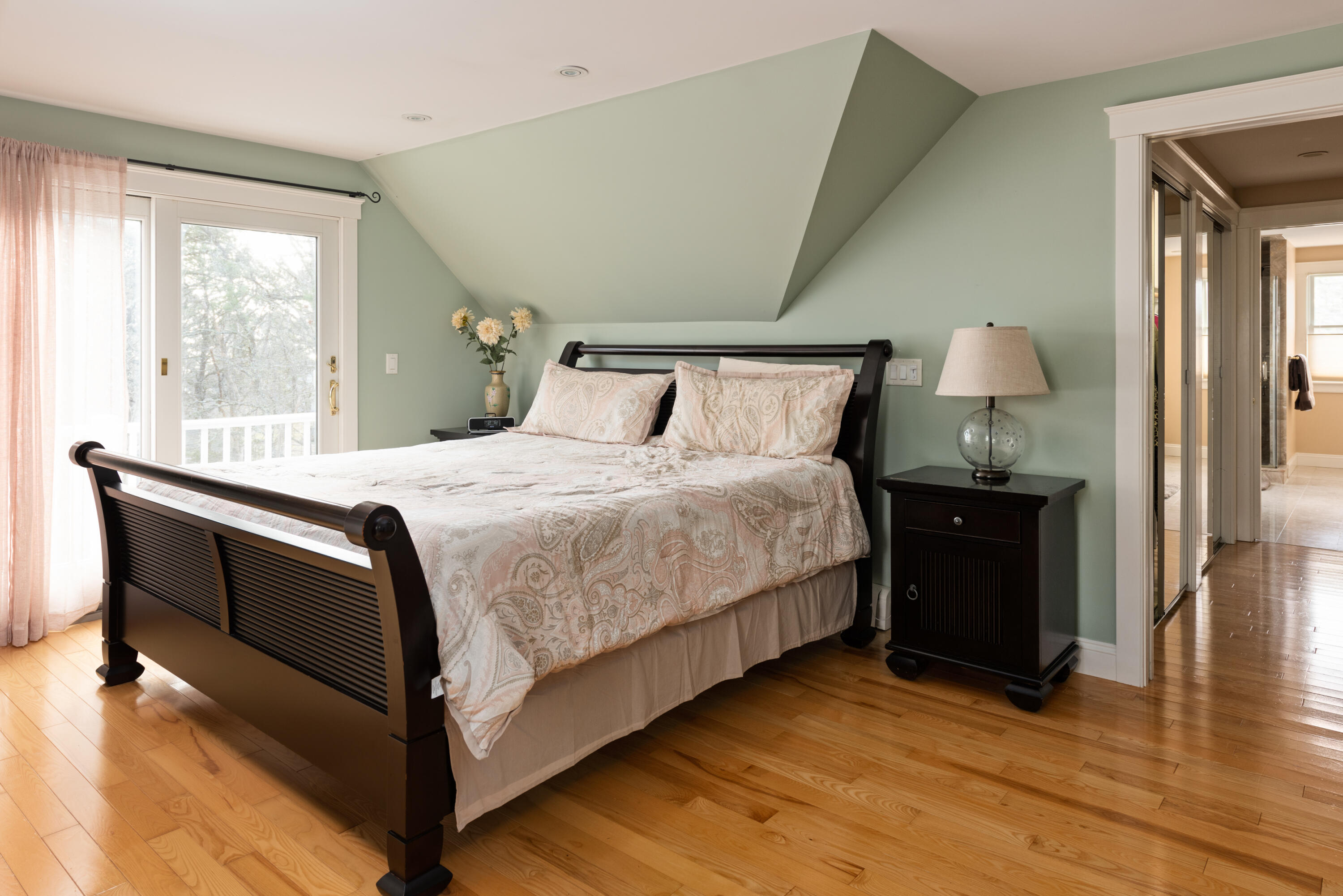 322 Pleasant Street Chatham, MA 02659 - Photo 24 of 39 a bedroom with a bed and wooden floor