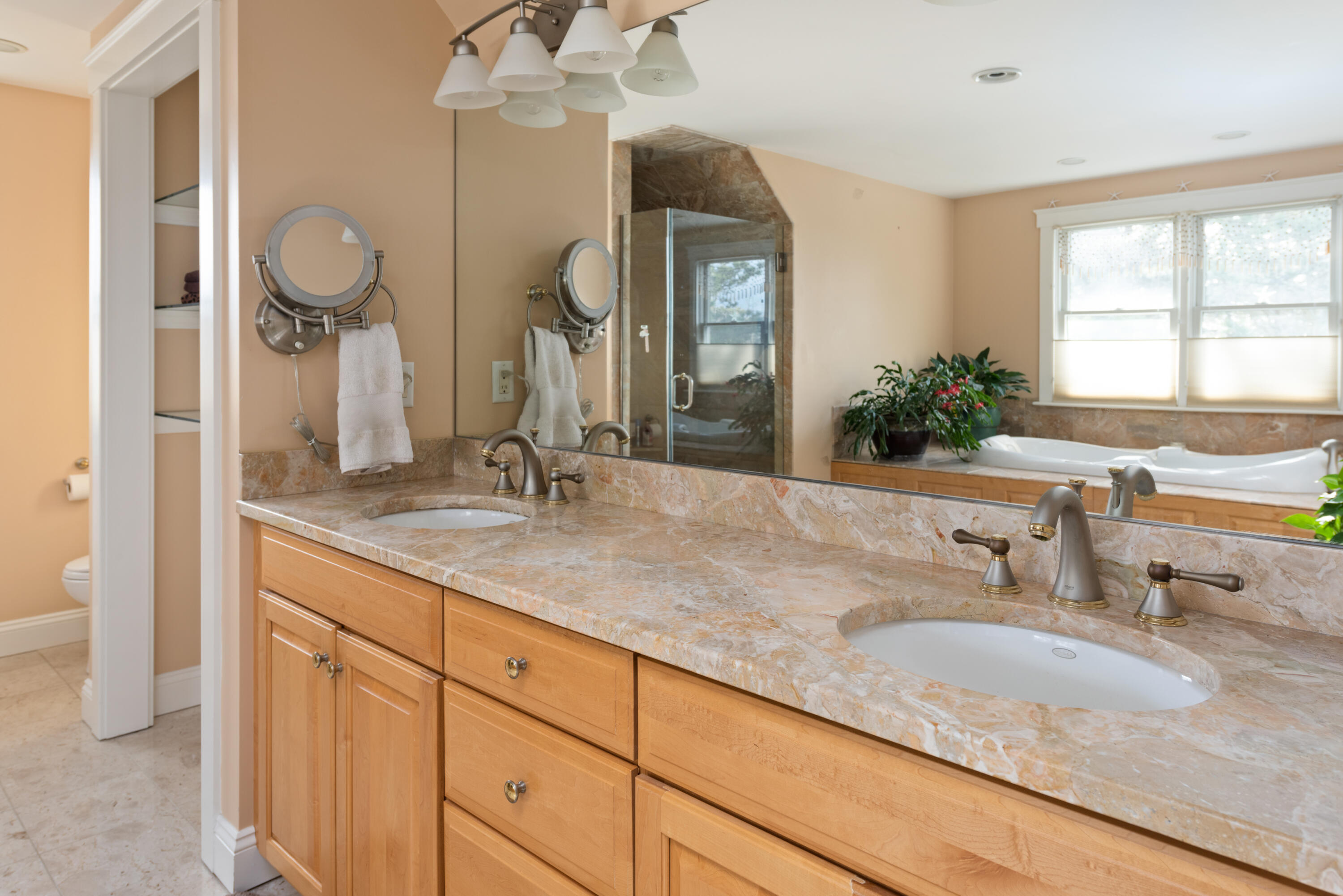 322 Pleasant Street Chatham, MA 02659 - Photo 26 of 39 a bathroom with a granite countertop sink a large mirror and a window