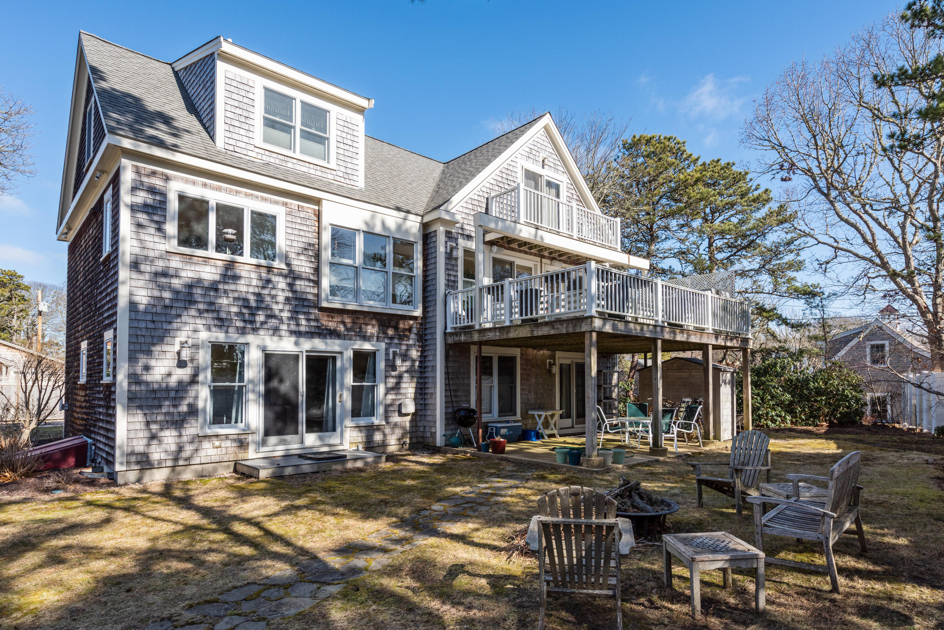 322 Pleasant Street Chatham, MA 02659 - Photo 30 of 39 a view of a building with a patio