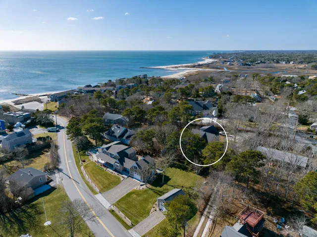 an aerial view of a house with a ocean view