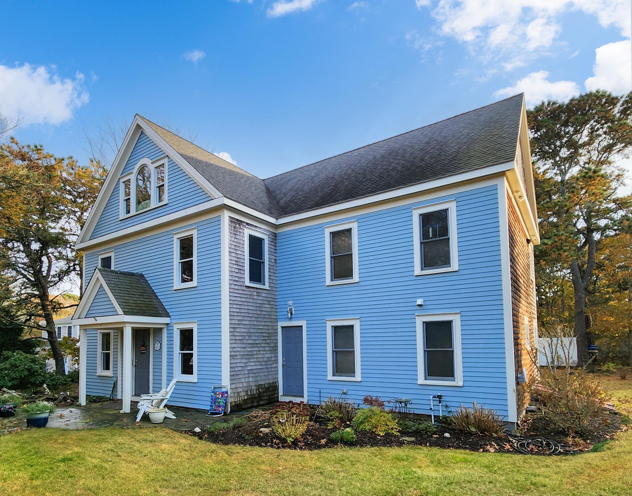322 Pleasant Street Chatham, MA 02659 - Photo 5 of 39 a front view of a house with a yard