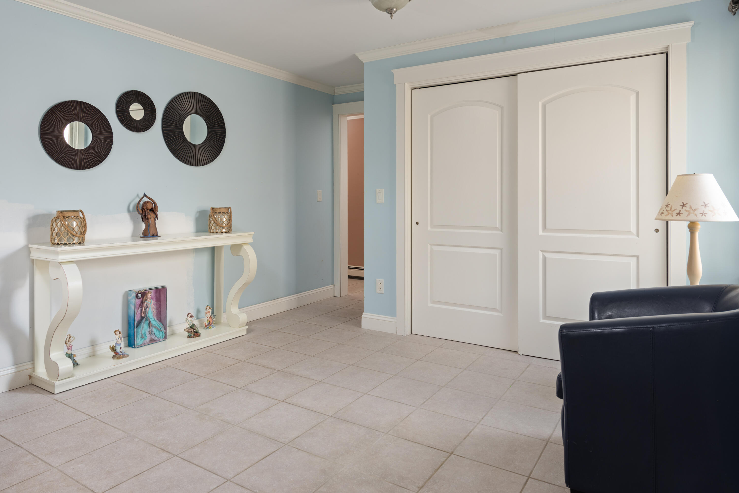 322 Pleasant Street Chatham, MA 02659 - Photo 8 of 39 a view of an empty room with rack and stairs