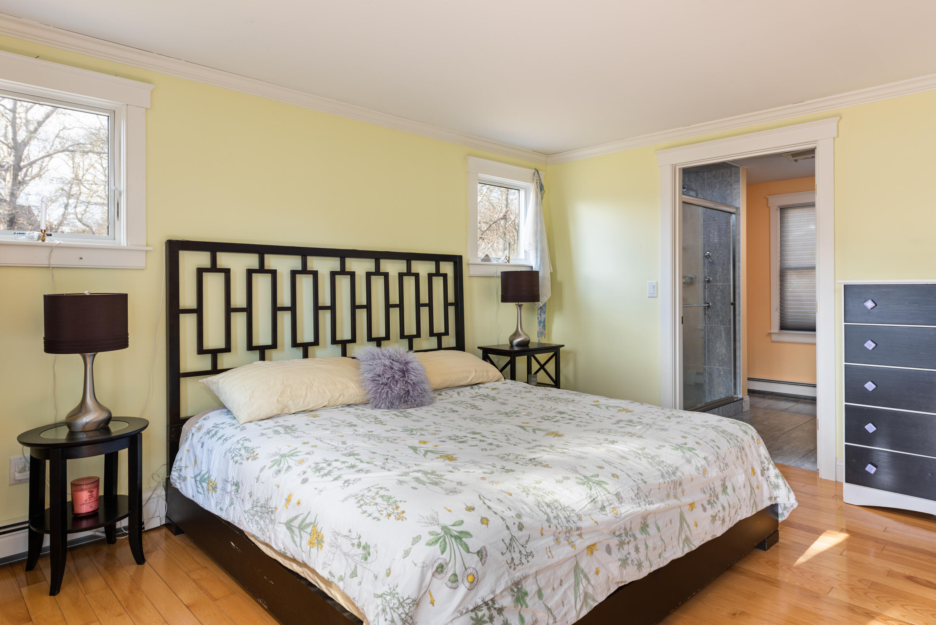 322 Pleasant Street Chatham, MA 02659 - Photo 10 of 39 a bed sitting in a bedroom next to a window and a lamp