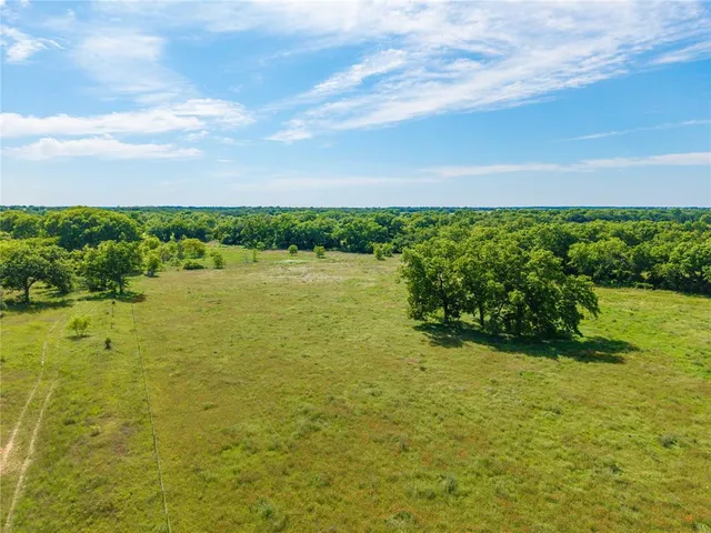 a view of a lake with a big yard