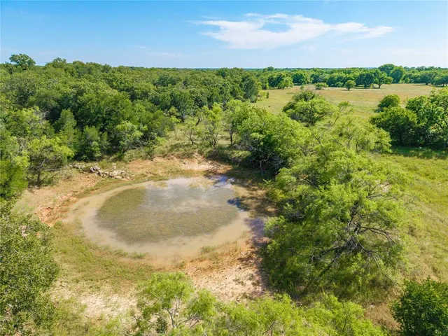 a view of a lake with houses in the back