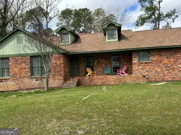 a view of a yard with an outdoor seating
