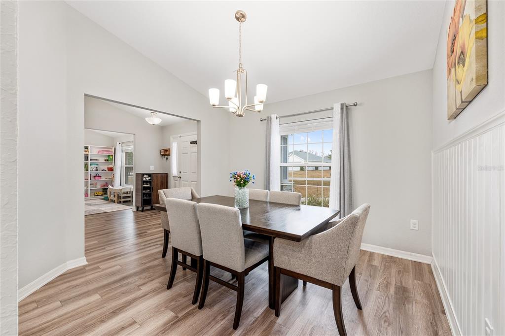 11275 Southwest 54th Circle Ocala, FL 34476 - Photo 21 of 63 a view of a dining room with furniture and wooden floor