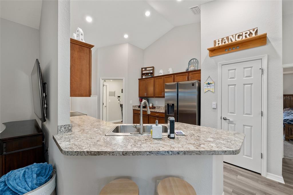 11275 Southwest 54th Circle Ocala, FL 34476 - Photo 22 of 63 a bathroom with a granite countertop sink and a mirror