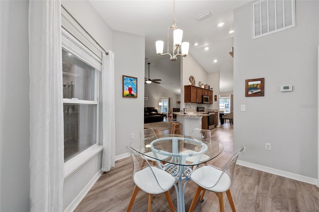 11275 Southwest 54th Circle Ocala, FL 34476 - Photo 28 of 63 a kitchen with dining table and chairs