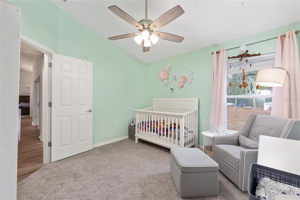 11275 Southwest 54th Circle Ocala, FL 34476 - Photo 33 of 63 a living room with furniture and a chandelier