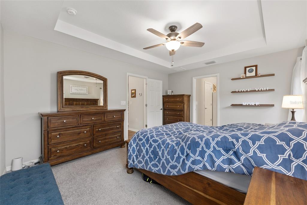 11275 Southwest 54th Circle Ocala, FL 34476 - Photo 35 of 63 a bedroom with a bed and cabinet