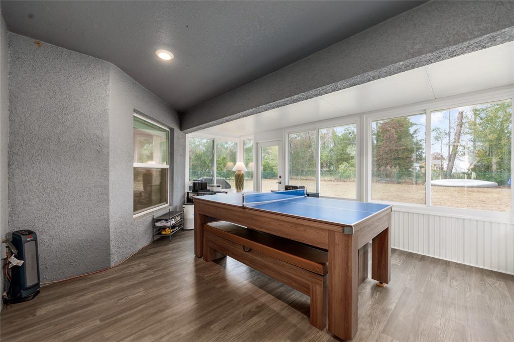 11275 Southwest 54th Circle Ocala, FL 34476 - Photo 42 of 63 a room with pool table and windows