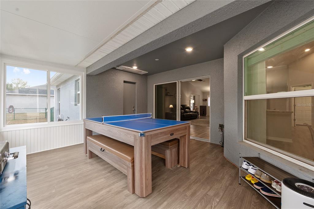 11275 Southwest 54th Circle Ocala, FL 34476 - Photo 44 of 63 a room with pool table and glass windows