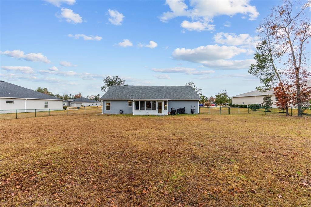 11275 Southwest 54th Circle Ocala, FL 34476 - Photo 48 of 63 a view of a house with a yard